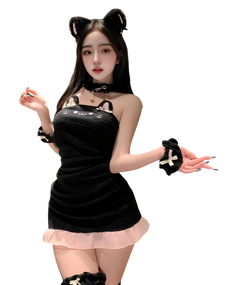 Woman in a black cat-themed outfit with ears and paws on a white background Woman in a black cat-themed outfit with ears and paws on a white background