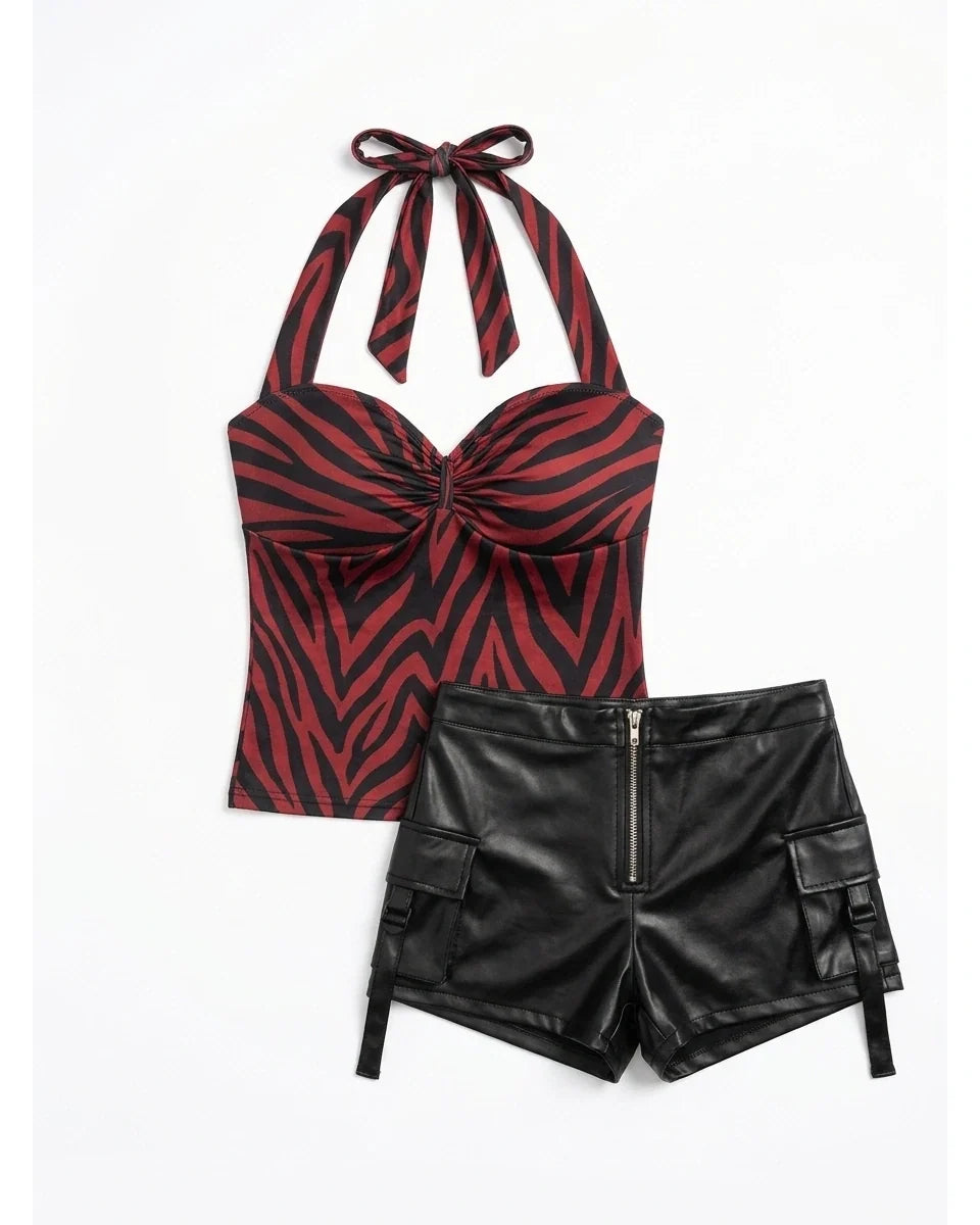 The same red zebra halter top and black faux leather shorts product flat lay on white background