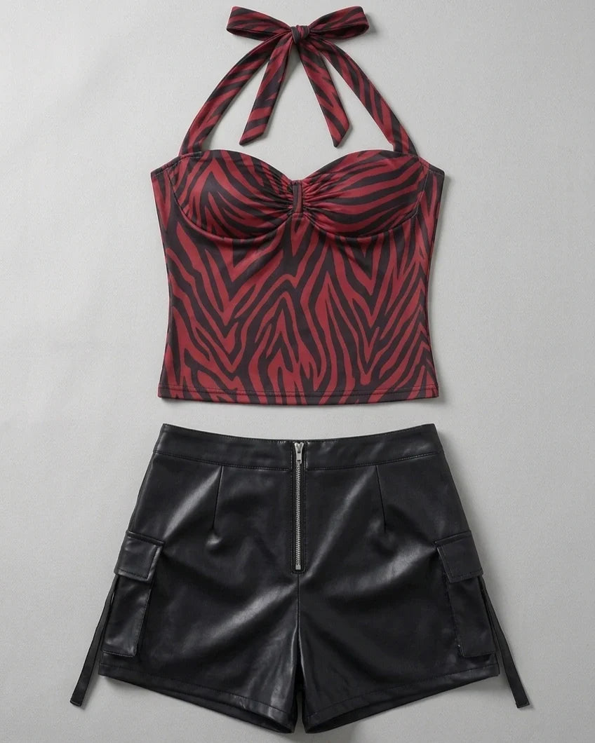 Front garment flat lay of red zebra halter top with black faux leather shorts