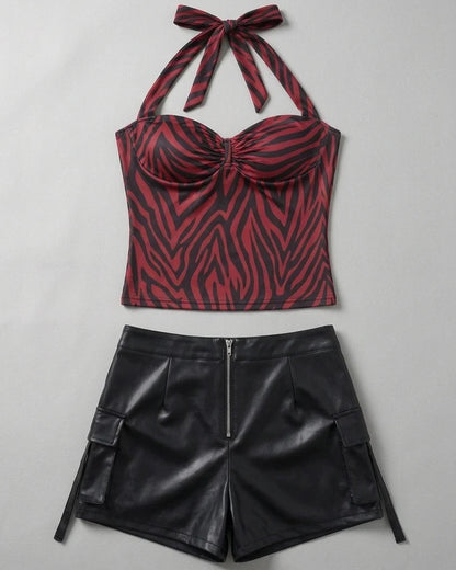 Front garment flat lay of red zebra halter top with black faux leather shorts