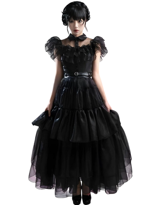 Woman wearing a black gothic-style dress on a white background