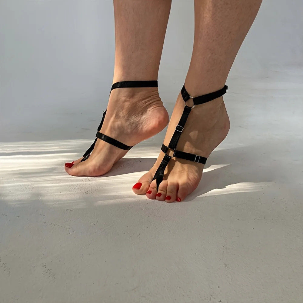 Black elastic strap anklet close-up