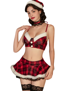 Woman wearing a red plaid lingerie set with a Santa hat on a white background