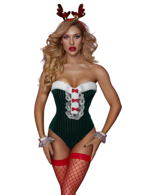 Woman wearing a festive green and red outfit with reindeer antlers on a white background