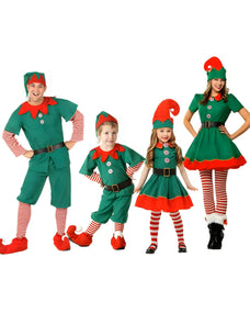 a happy family wearing matching Christmas elf costumes
