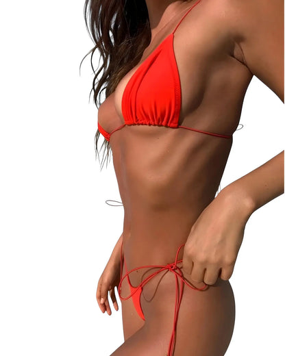 Red bikini worn by a person on a white background