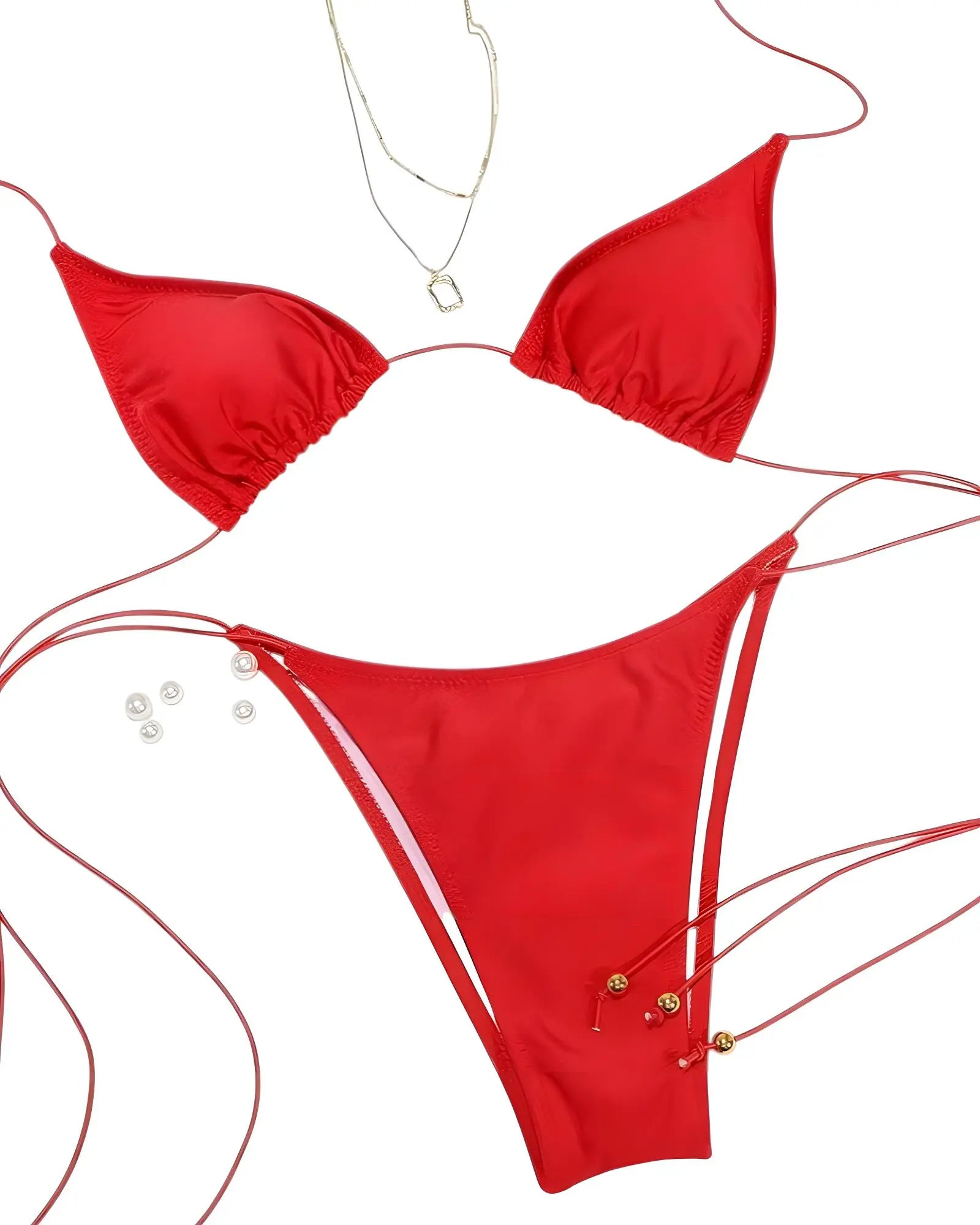 Red bikini set with pearl details on a white background