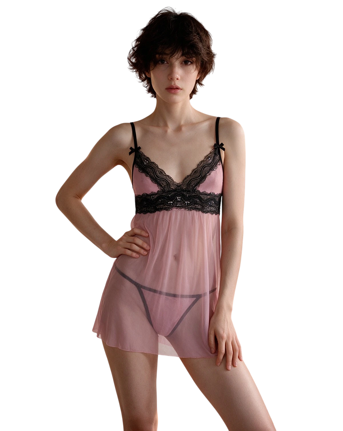 A model wearing a sheer pink babydoll lingerie chemise with black lace trim and black undergarments, set against a plain white background.