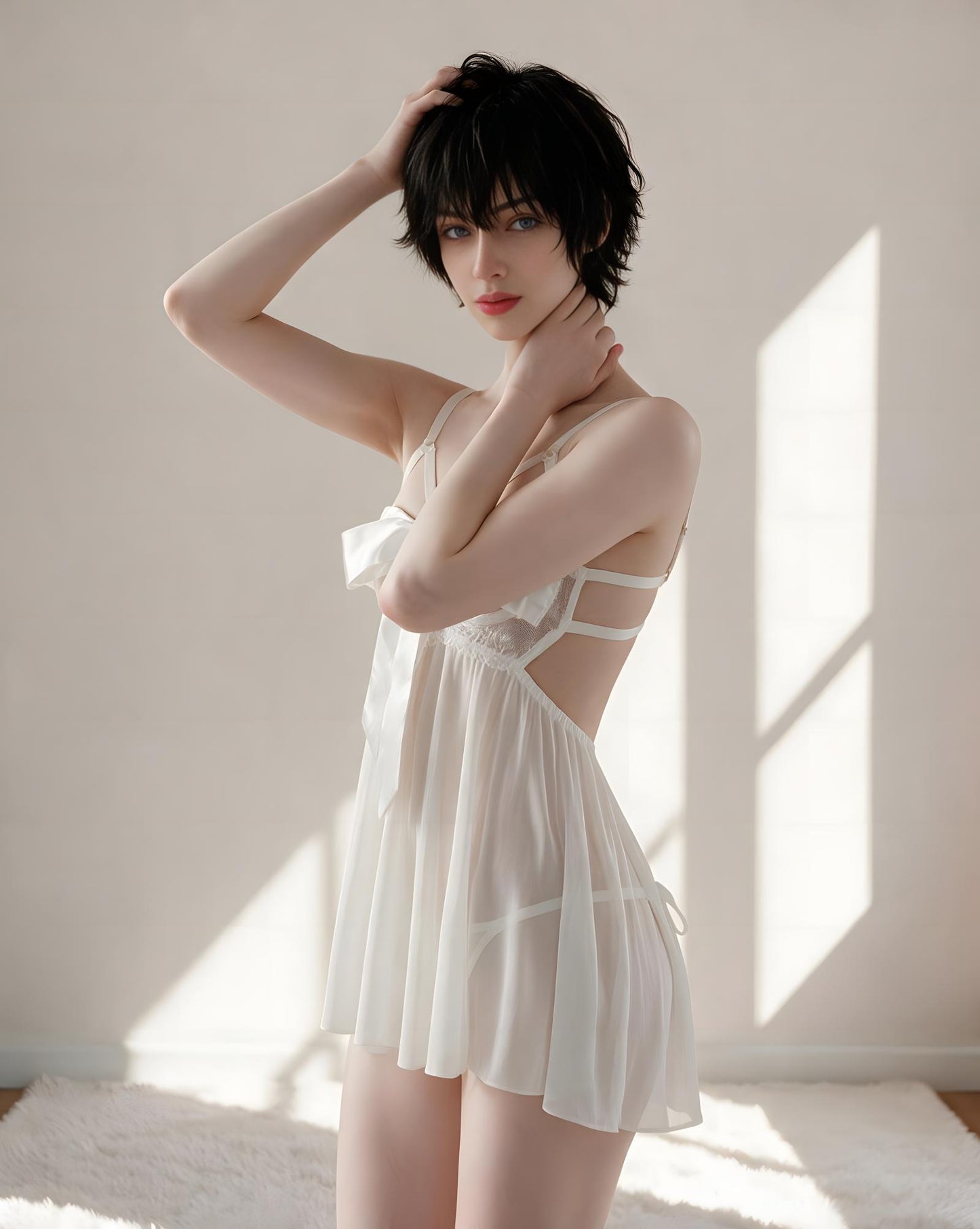A woman with short dark hair models a white sheer babydoll lingerie dress in a brightly lit room with soft window shadows.