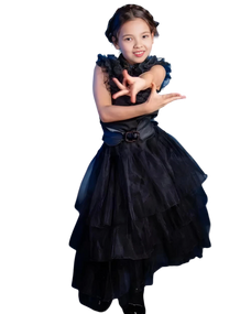 Young girl wearing a black dress with ruffled sleeves on a white background