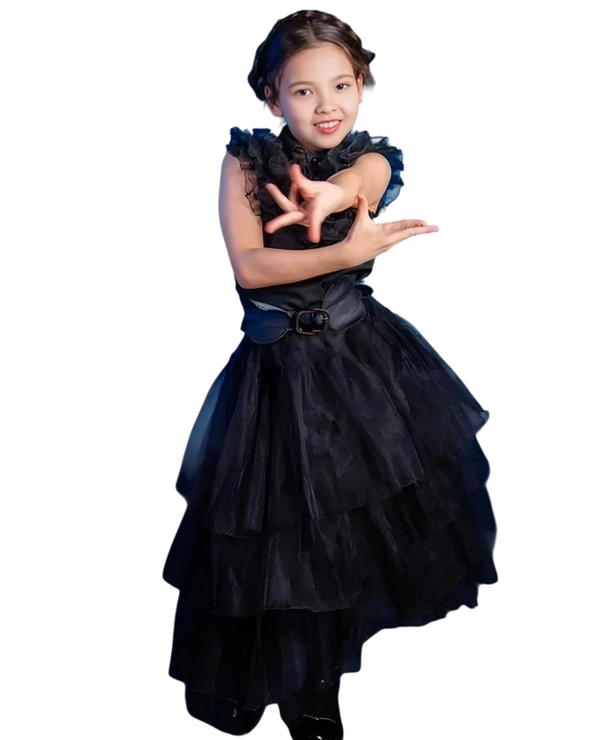 Young girl wearing a black dress with ruffled sleeves on a white background