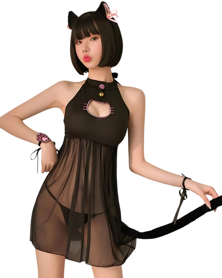 Woman wearing a black cat-themed dress with a white background