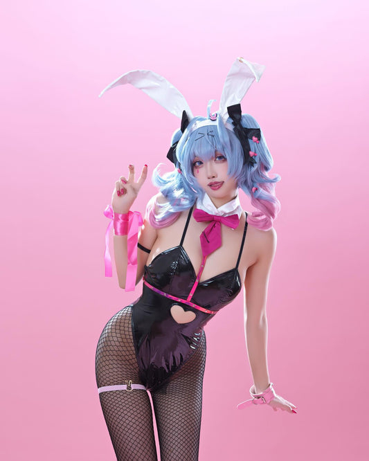 Person in a bunny costume with rabbit ears and pink hair on a pink background