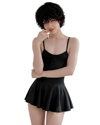 A model wearing a black spaghetti-strap camisole top and a matching black pleated mini skirt, set against a solid white background.