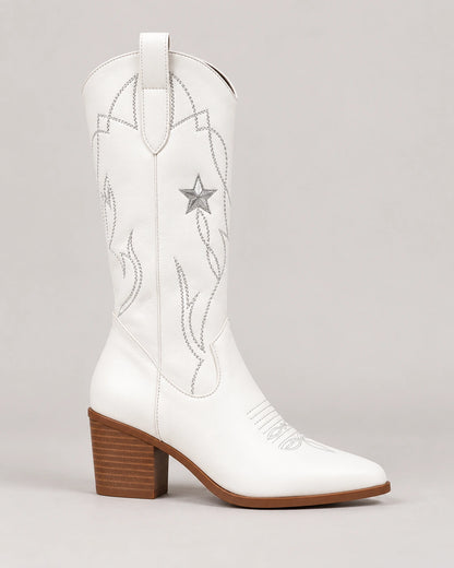 Side profile of a white pointed toe cowboy boot with star embroidery and block heel