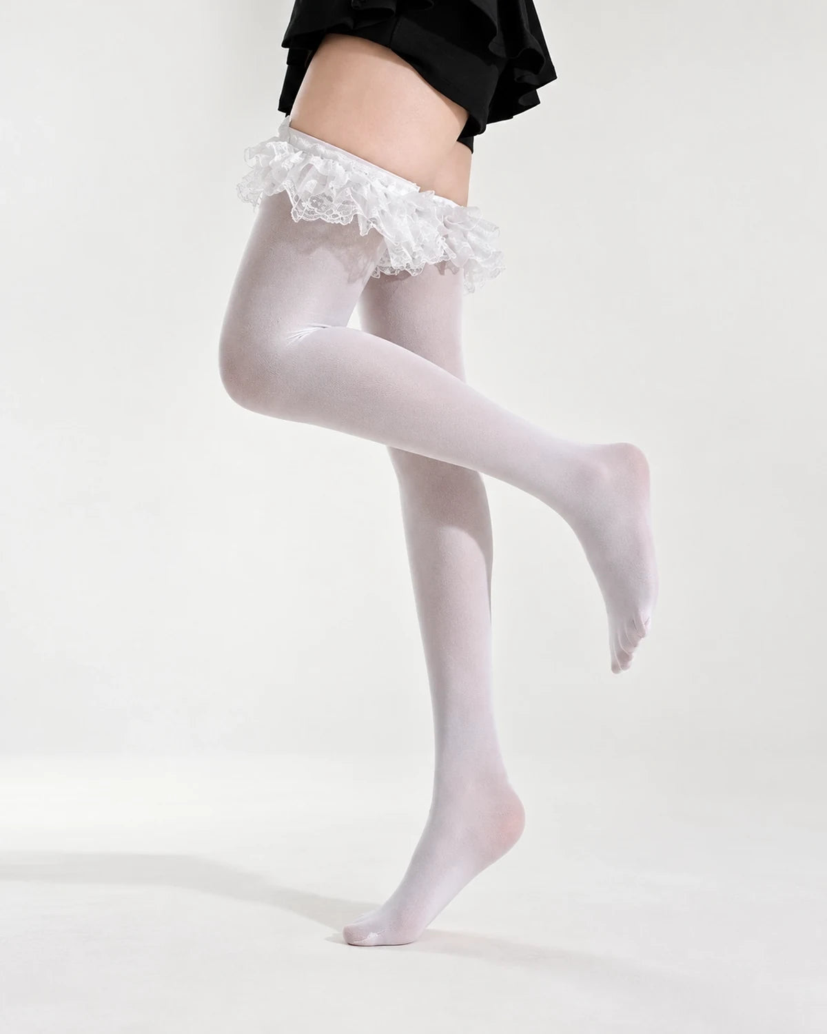 White thigh high stockings with layered lace ruffles in side profile